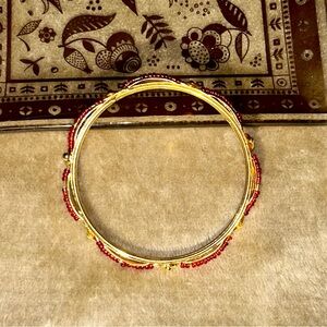 Gold-Tone Women’s Bangle Bracelet with Red Bead Accents